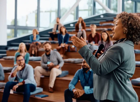 female-speaker-talking-on-a-business-conference-at-convention-center-