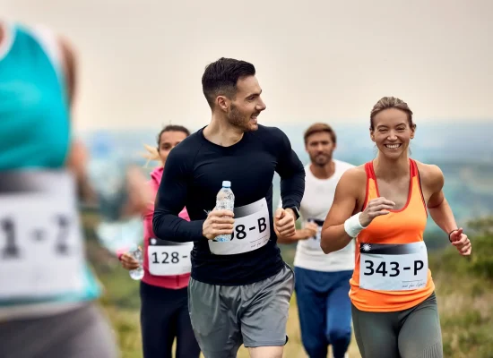 young-happy-athletic-couple-running-marathon-in-nature-